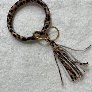Key chain with leopard print vinyl wristlet and tassle